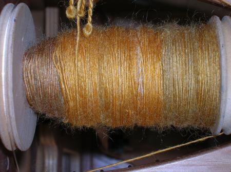 butterscotch wool on bobbin