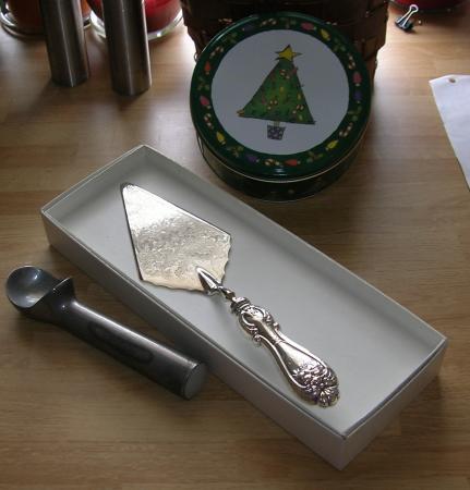 ice cream scoop, pie server, Xmas tin